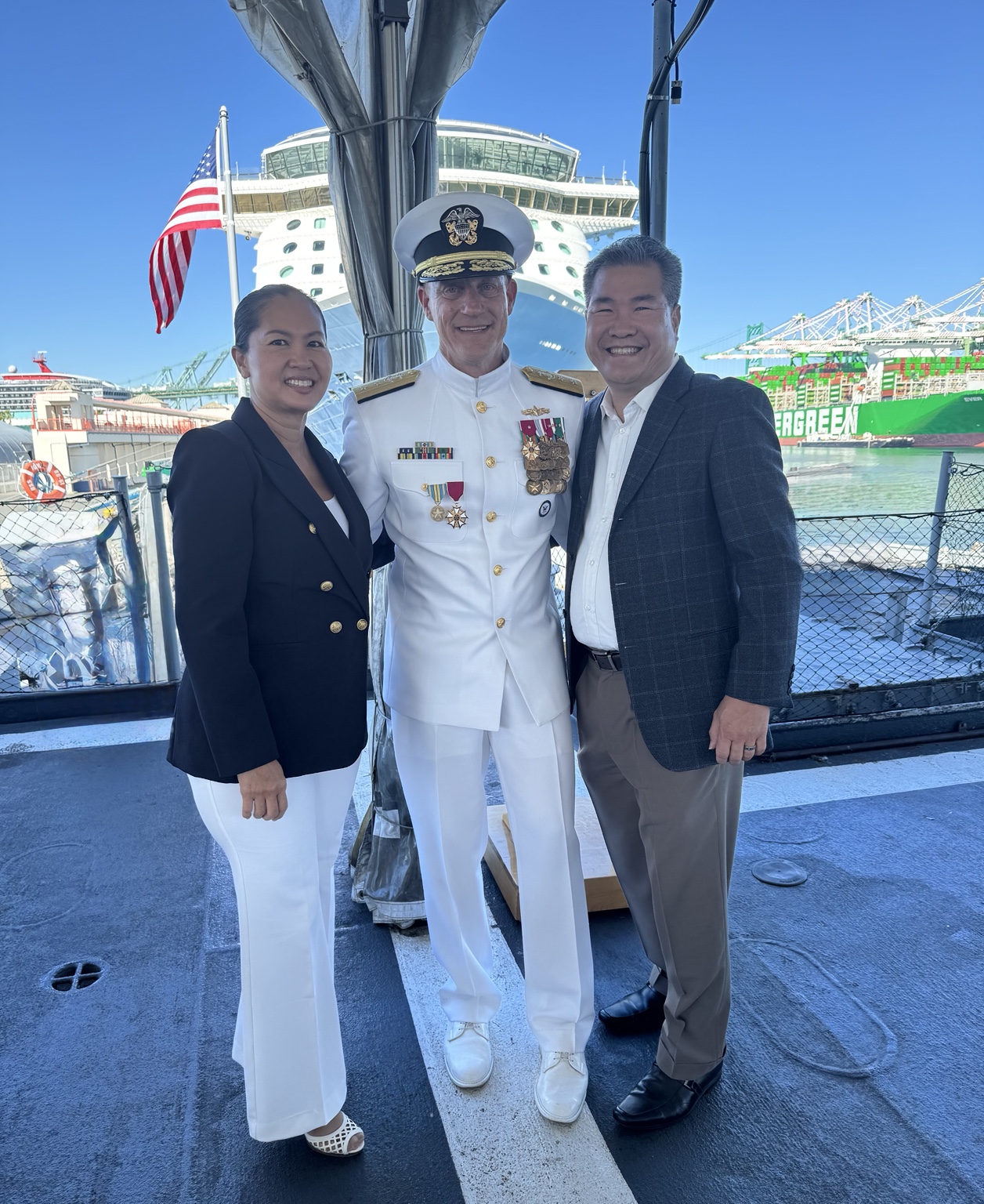 Darren and Chrystina Dang with Rear Admiral Robert Nowakowski after his retirement ceremony.