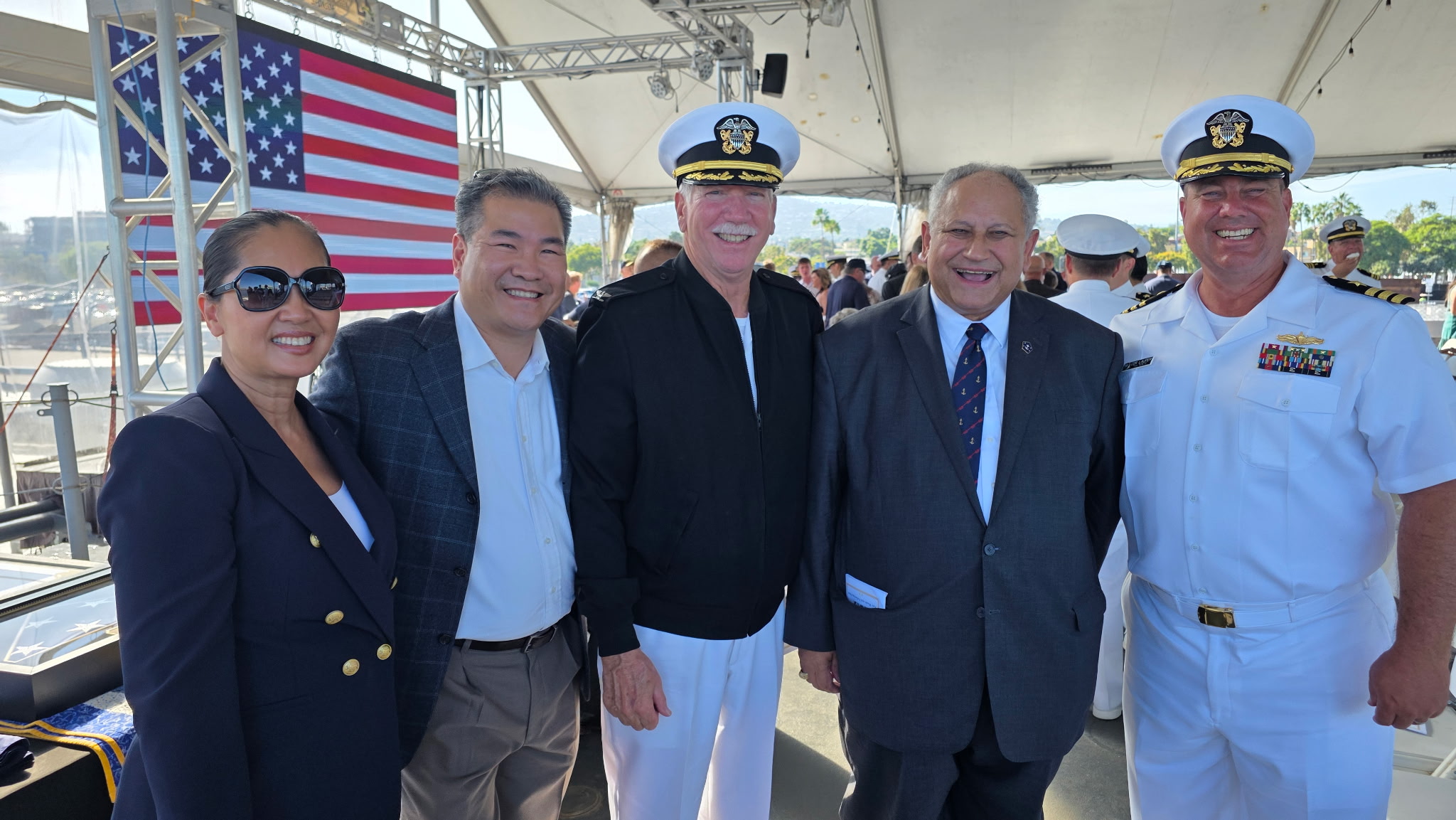 Darren and Chrystina Dang with CDR Lauper and former Secretary of the Navy Carlos Del Toro at the retirement event.